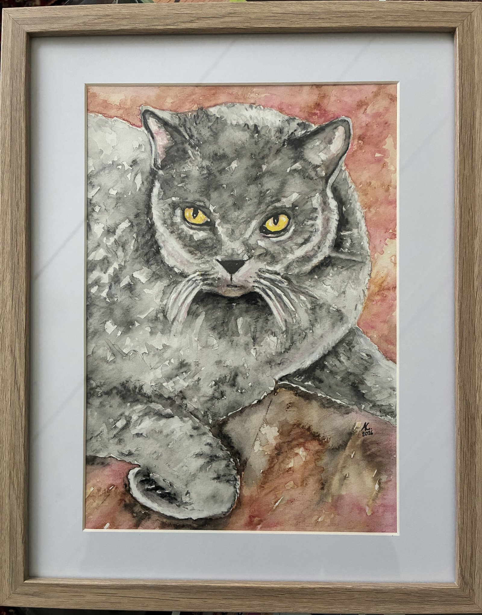 Watercolour portrait of a grey British Shorthair cat with striking yellow eyes, by Anthea Messmer